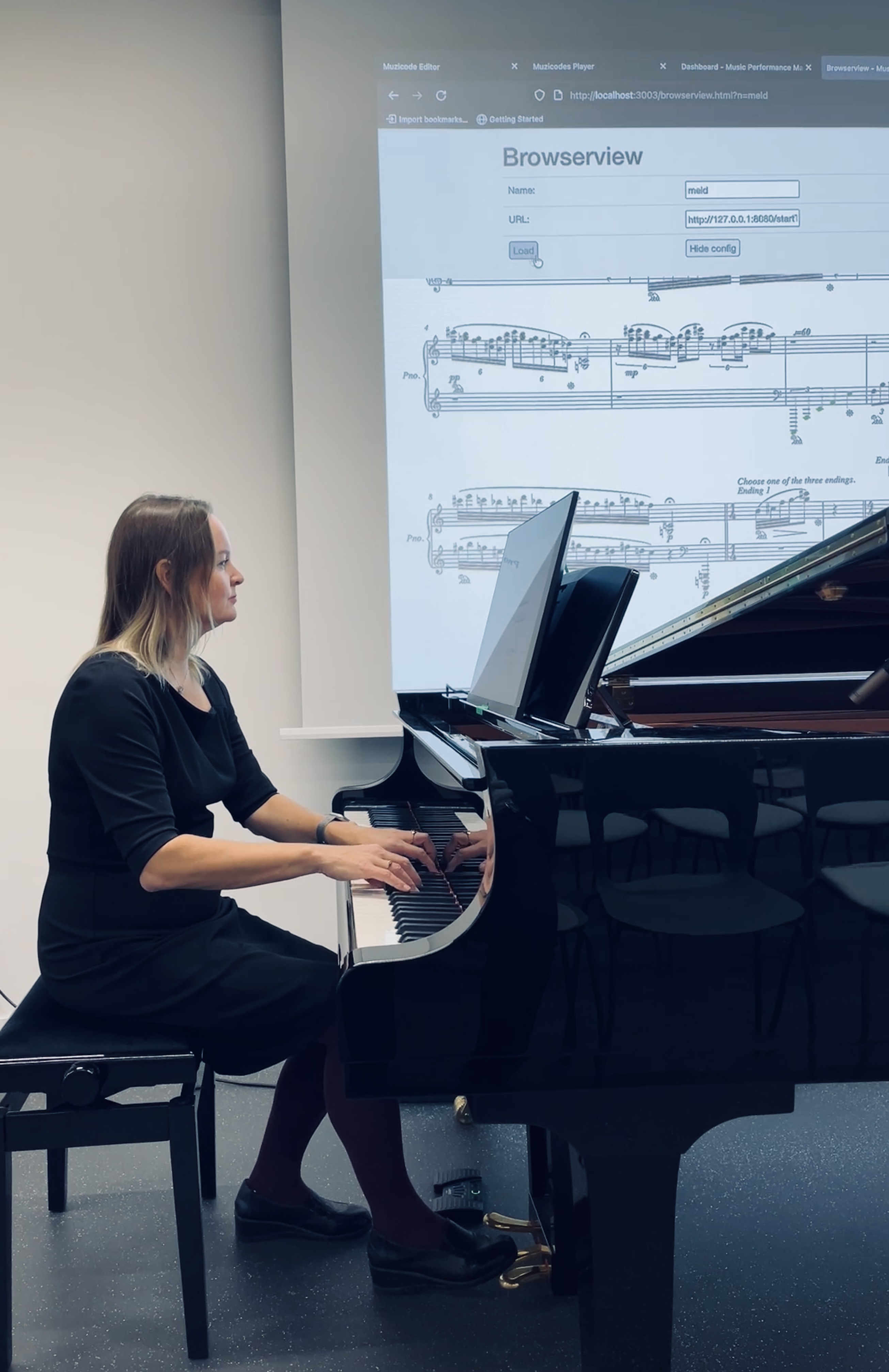 Maria performing with screen-based notation system